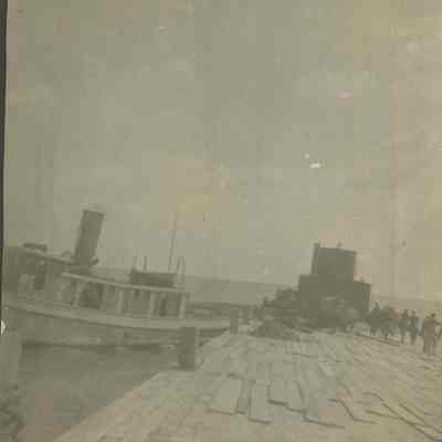 Tugboat alongside barge