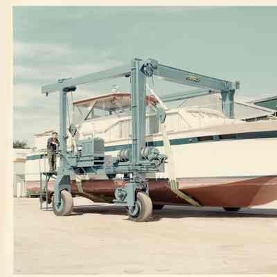 Self propelled Travelift holding yacht