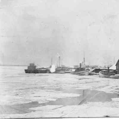 Ships at pier in winter