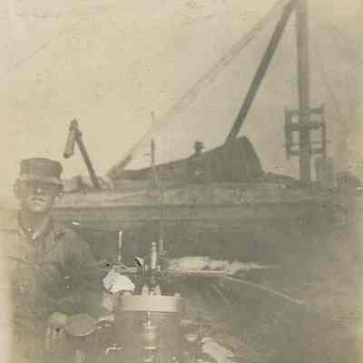 Worker with pump on boat