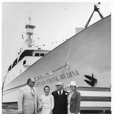 PBI four people in front of tuna seiner Captain Frank Medina