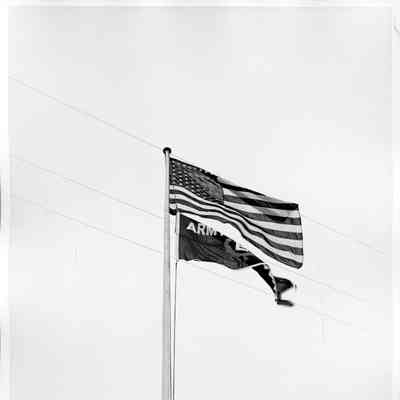 Flag pole with American flag and army E flag