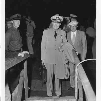 C. Ray Christianson and officer at christening of LST-1166, September 9, 1953