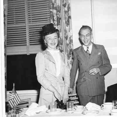 E.A. Ander and wife at dining table during E award