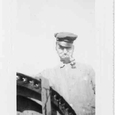 Man with pipe and cup
