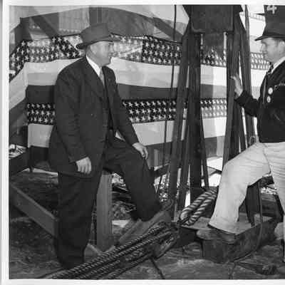 C. Ray Christianson and Unidentified workman