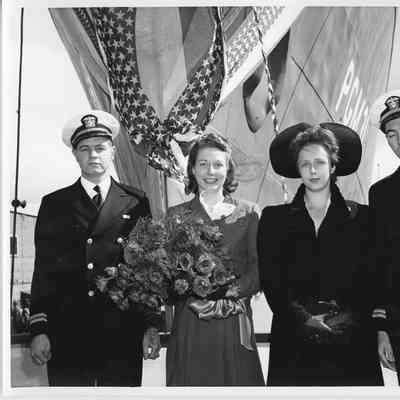 Lt. and Mrs. Harold Hilmar christening PGM-31 and unidentified couple