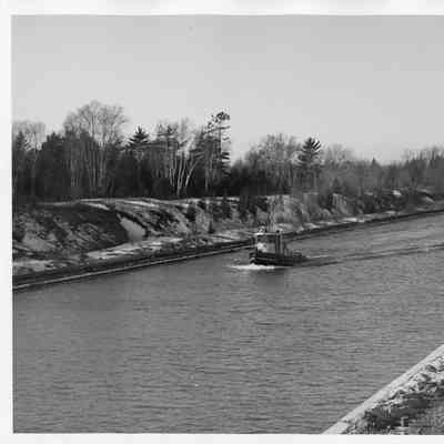 US Engineer Department tug underway in canal in winter