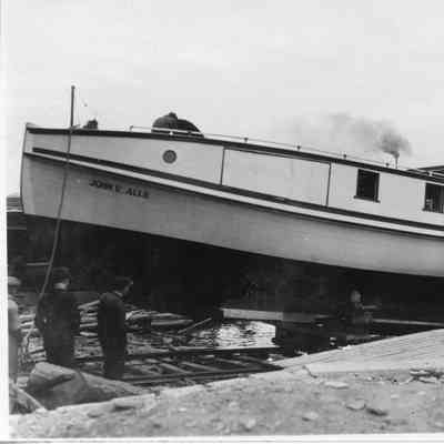 Fishing tug John V. Allie on wooden supports