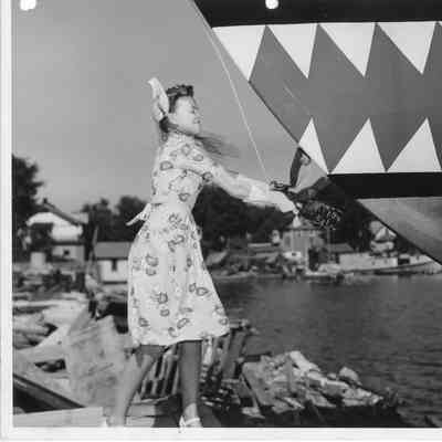 Woman christening P-570 at Peterson Boat Works June 17, 1944