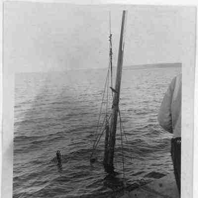 Half Moon being raised with mast above water