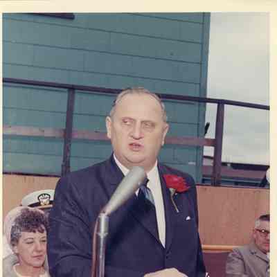 Man speaking at PG-99 USS Beacon christening