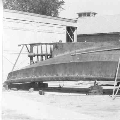 Five men constructing PBI boat Escort