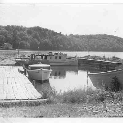 two boats tied to dock