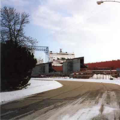 Dredge scow sections alongside Edgar B. Speer at Bay Shipbuilding 2002