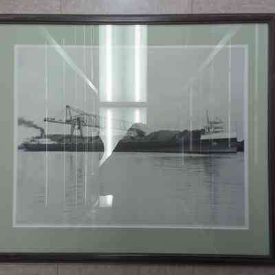 Framed photograph of a Reiss Brothers vessel loading coal