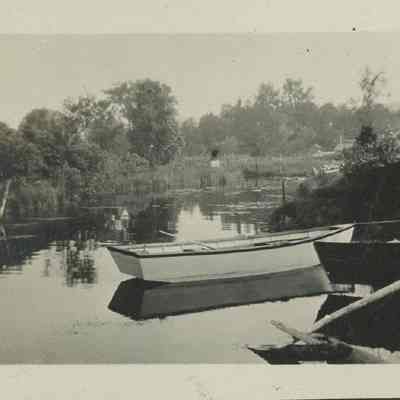 Rowboat docked in creek 1916