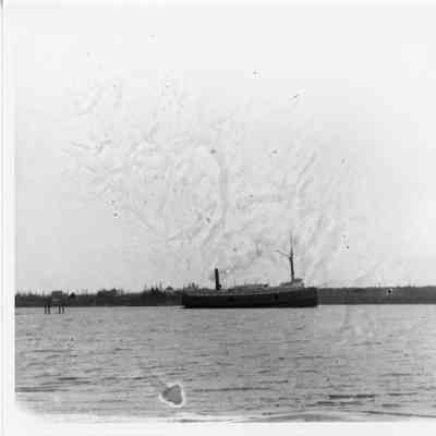Unidentified vessel in water near shore