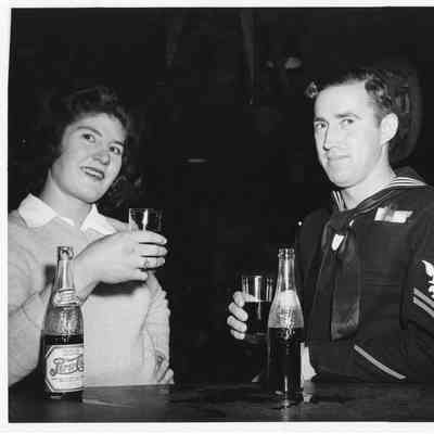 Woman and serviceman drinking Pepsi