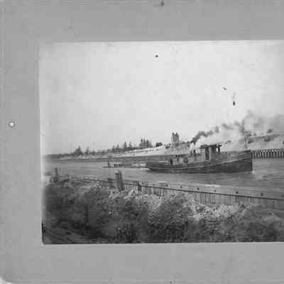 unidentified vessel going through canal