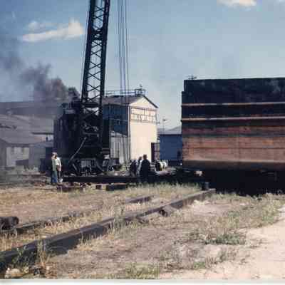 Crane blowing black smoke at SBSB&DD Co.