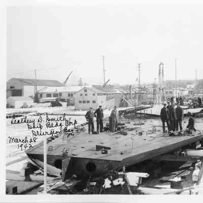 Men standing on hull at Leathem D. Smith Shipbuilding Co. 1942