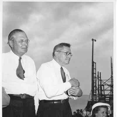 Two unidentified men in white shirts in attendance at launching
