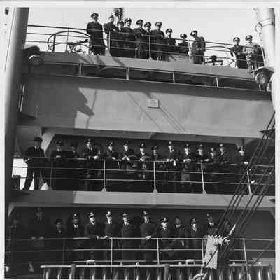 Sailors aboard AK-214 Tarrant