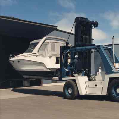 Travelift forklift holding yacht