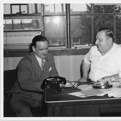 C.D. Brower Jr. seated at his desk
