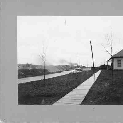 Barge in distance going through canal