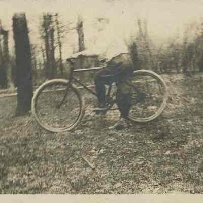Man poses with a bicycle