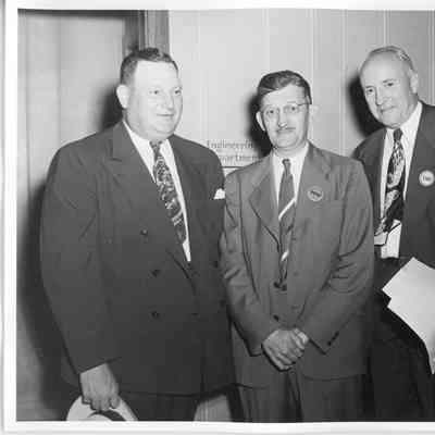 Wolcott E. Spofford standing between two men