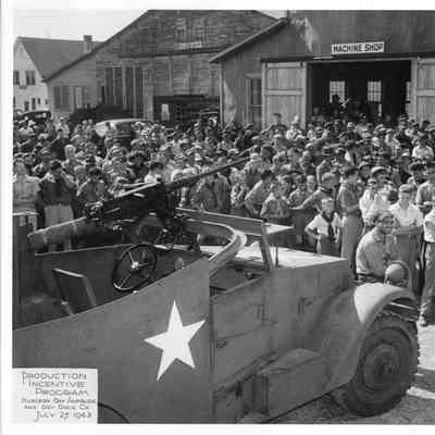 Group of men in front of truck during SBSB&DD Co. production incentive program July 27, 1943