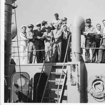 Men posing on deck of US Army F-7