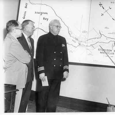 four men looking at map of Sturgeon Bay