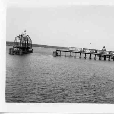 Leathem and Smith bridge in open position with railroad cars on trestle