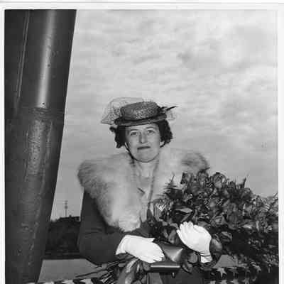 Mrs. Paul H. Towsend holding roses