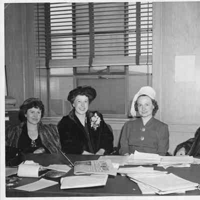 Alva Smith and three women at conference table