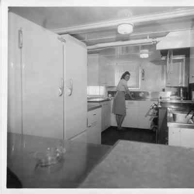 Woman standing in ship's galley March 2, 1947
