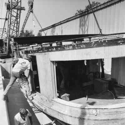 Hope being fit into berth at Door County Maritime Museum Gills Rock 1992