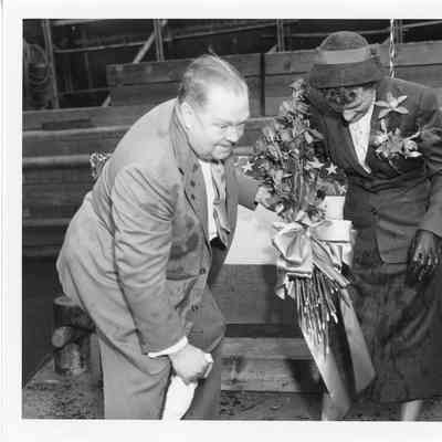 Woman and man cleaning champagne off clothes after christening of Spartan September 6, 1952