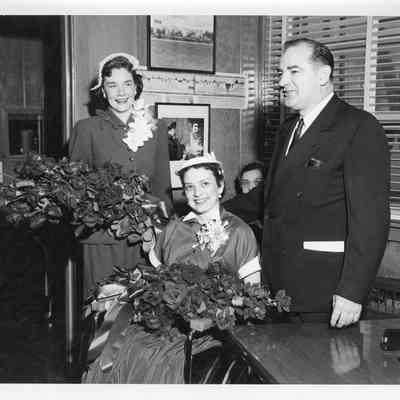 Patricia VanRooy, Joan and Joseph McCarthy, and one other woman in office at christening of LST-1170