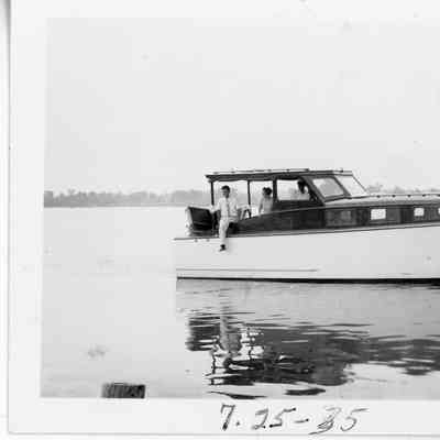 Three people on Peterson Boat Works pleasure craft June 25, 1935
