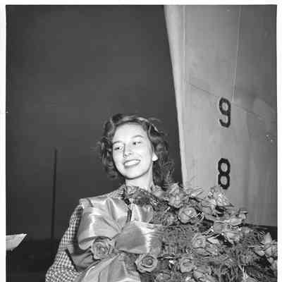 Miss Felice Fergeson holding flowers at christening of PC-821