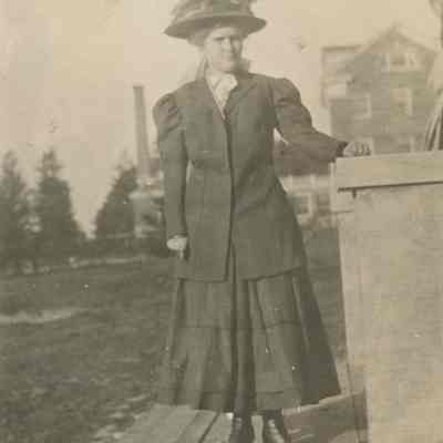 Woman standing by steps