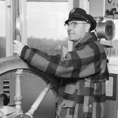 Pilot at wheel of ferry