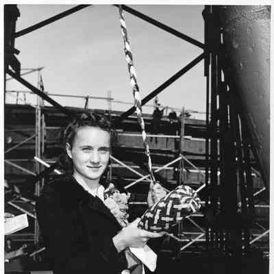 Marilyn Hughes about to christen AK-209 Schyler