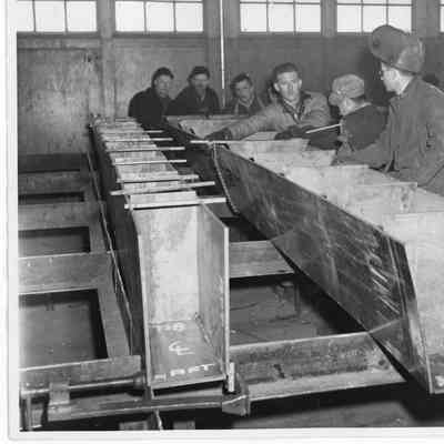 Group of workers with welding equipment