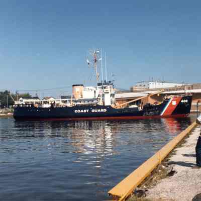 USCG buoy tender Acacia turning to dock in Two Rivers 1986
